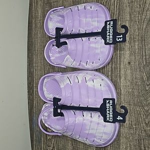 Purple and white clogs